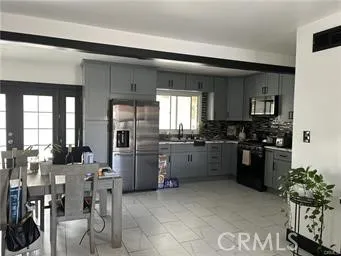 a kitchen with lots of counter top space and stainless steel appliances
