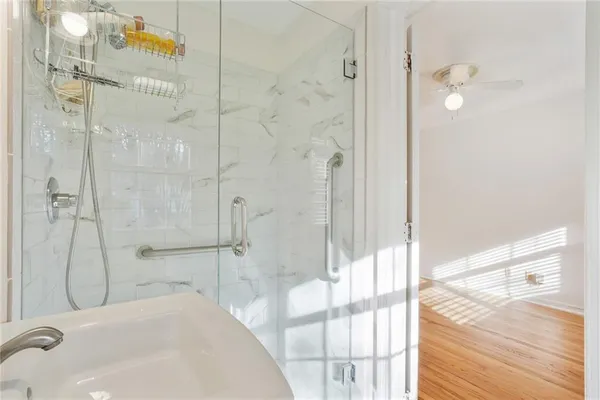 a bathroom with a sink and shower