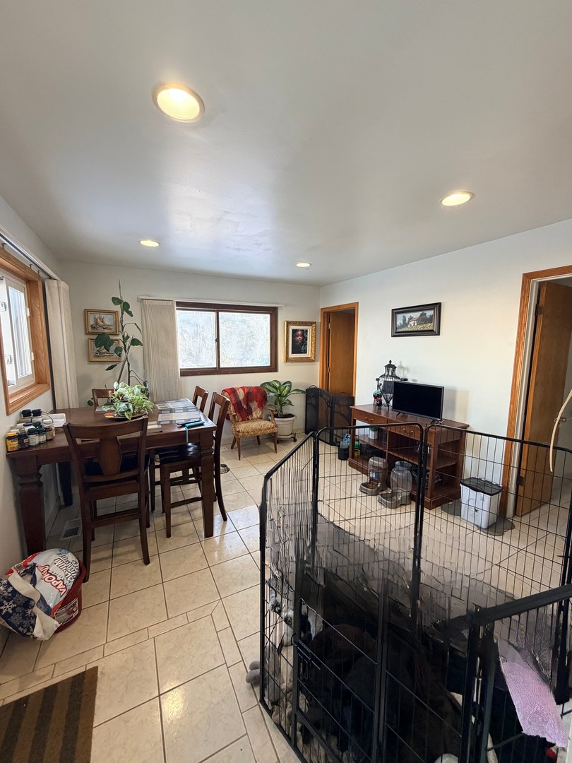 9013 Oriole Avenue Morton Grove, IL 60053 - Photo 12 of 17 a living room with lots of furniture and a wooden floor