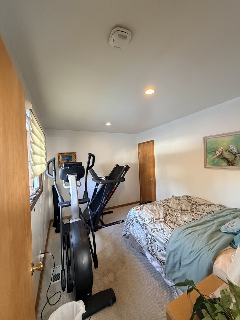 9013 Oriole Avenue Morton Grove, IL 60053 - Photo 13 of 17 a bedroom with a bed and dresser