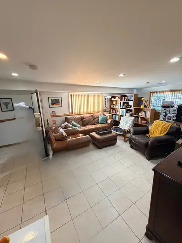 a view of a garage with a car parked in it