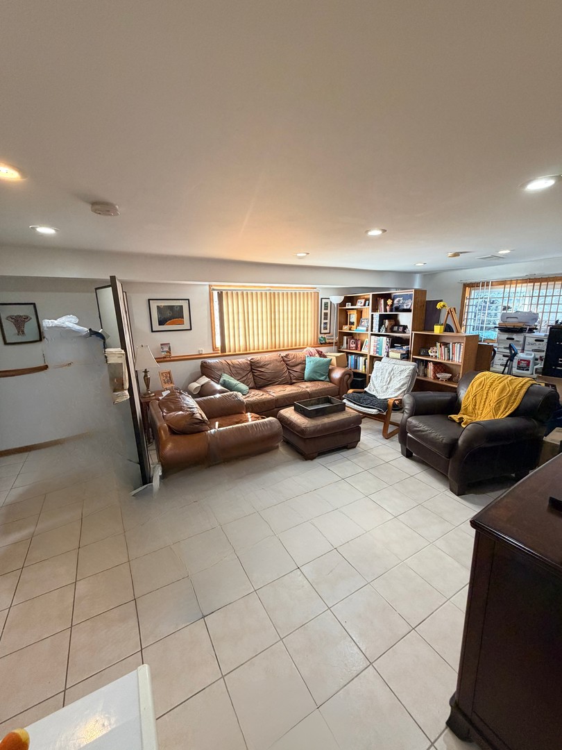 9013 Oriole Avenue Morton Grove, IL 60053 - Photo 15 of 17 a living room with furniture and a lamp