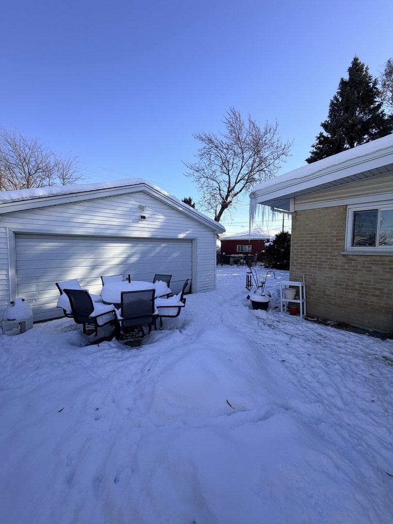 9013 Oriole Avenue Morton Grove, IL 60053 - Photo 16 of 17 a view of a garage with a car parked in it