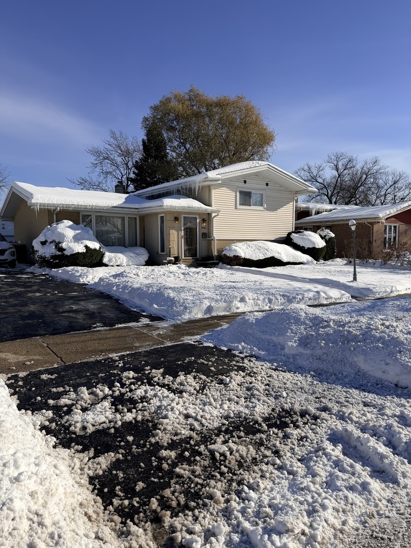 9013 Oriole Avenue Morton Grove, IL 60053 - Photo 2 of 17 a view of a house with a yard