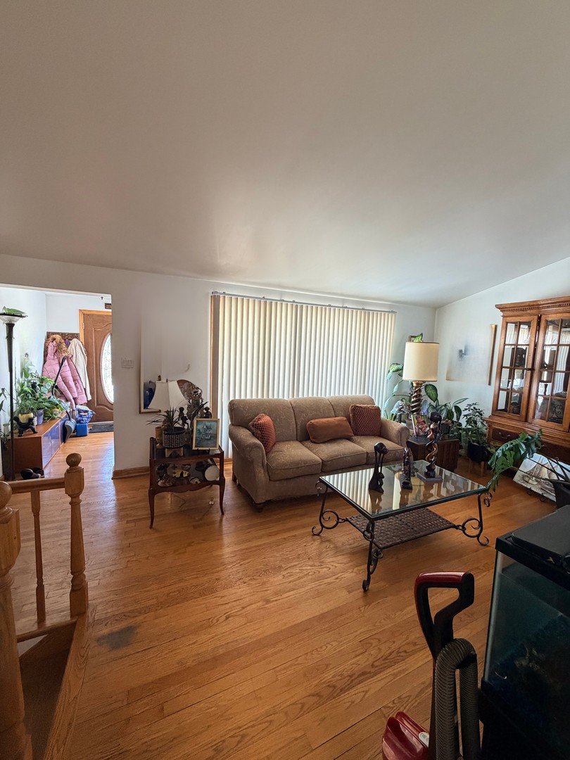 9013 Oriole Avenue Morton Grove, IL 60053 - Photo 5 of 17 a living room with furniture and a wooden floor