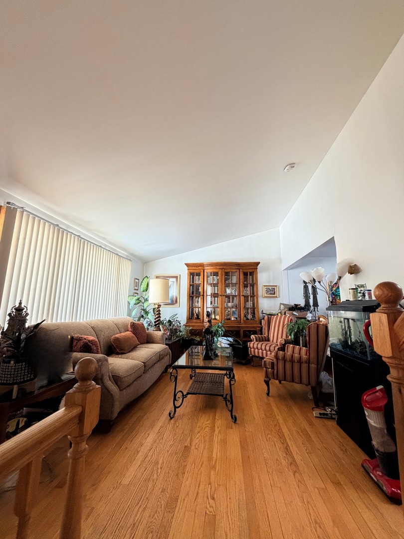9013 Oriole Avenue Morton Grove, IL 60053 - Photo 6 of 17 a living room with furniture and a wooden floor