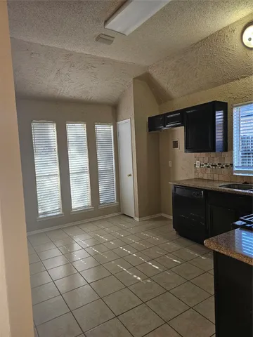 a living room with a couch and a flat screen tv