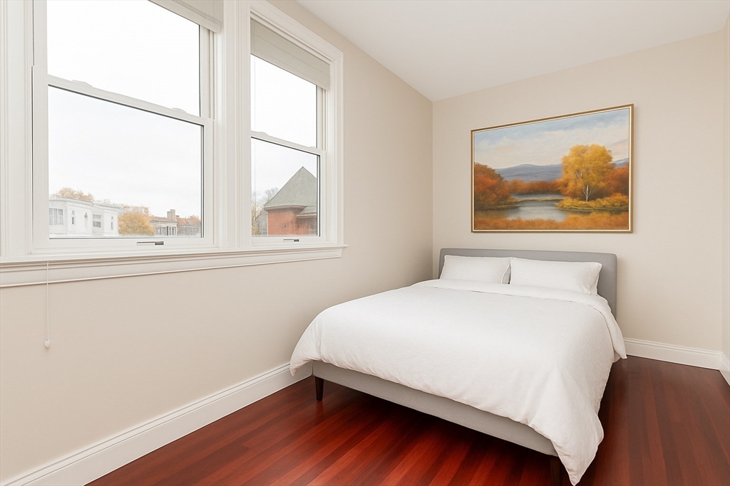 55 Kelly Road, Unit 3 Cambridge, MA 02139 - Photo 2 of 10 a bedroom with a bed and a window