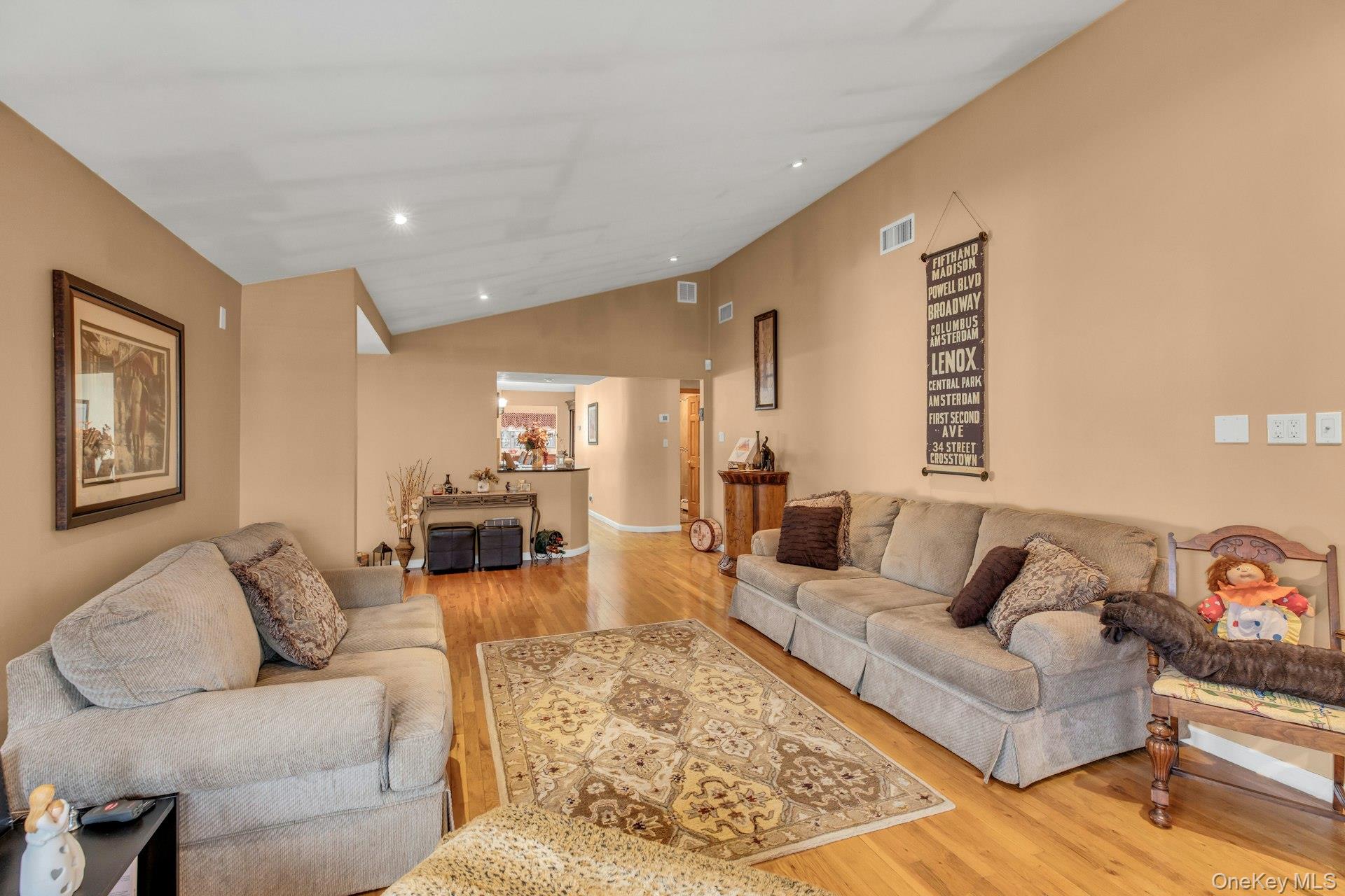 1044 Commack Road Dix Hills, NY 11746 - Photo 12 of 29 Living room featuring lofted ceiling, light wood-type flooring, and recessed lighting