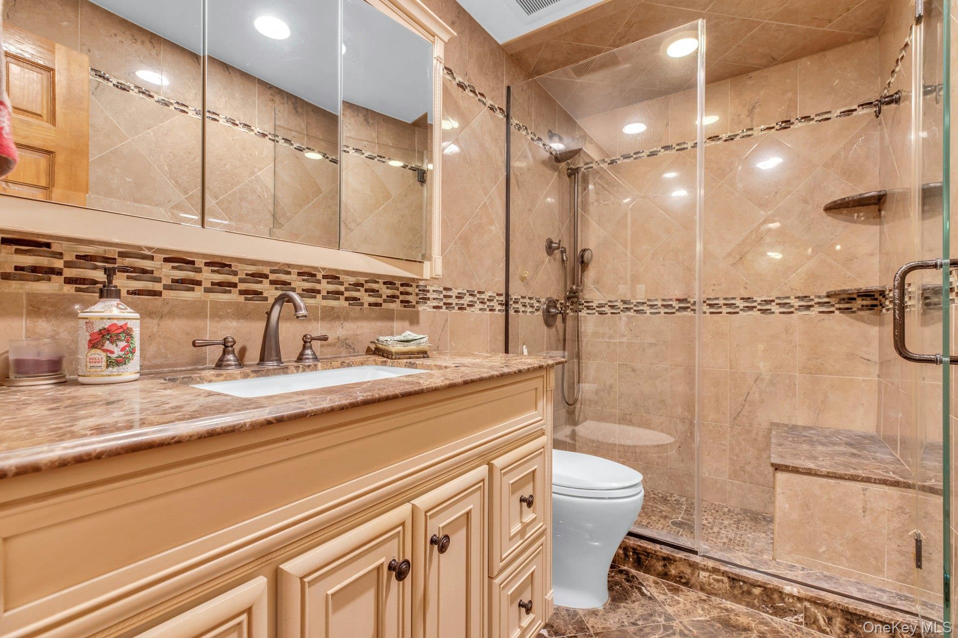 1044 Commack Road Dix Hills, NY 11746 - Photo 26 of 29 Full bath featuring vanity, a stall shower, tile walls, recessed lighting, and backsplash