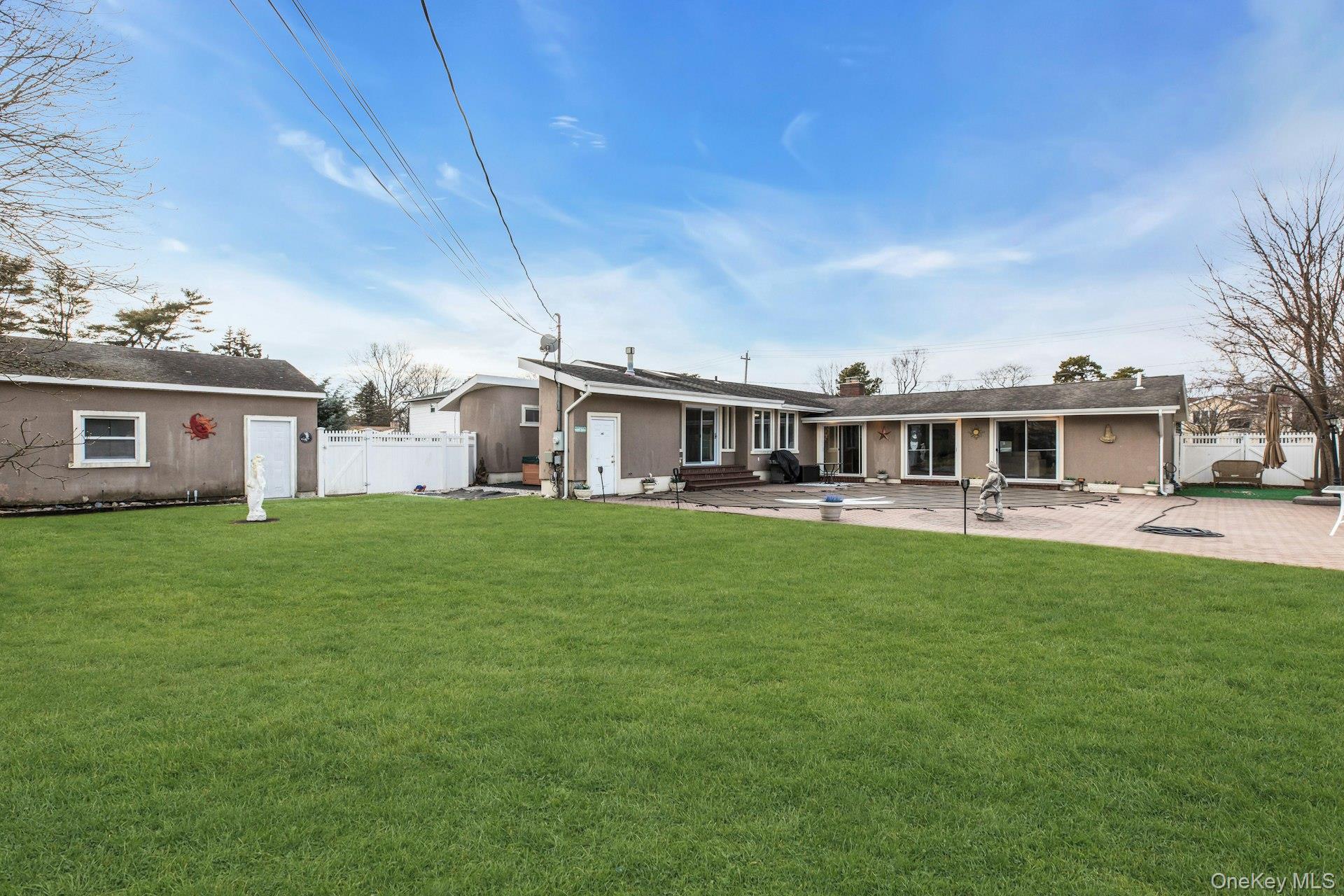 1044 Commack Road Dix Hills, NY 11746 - Photo 29 of 29 Rear view of property with a patio, a chimney, and entry steps