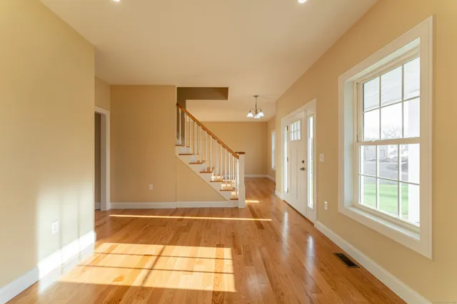 a view of an entryway with a floor to ceiling window