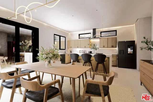 a view of a dining room with furniture and a chandelier
