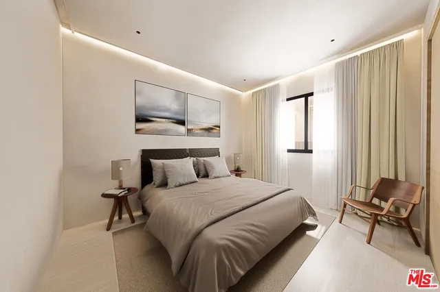 a bedroom with a bed and window