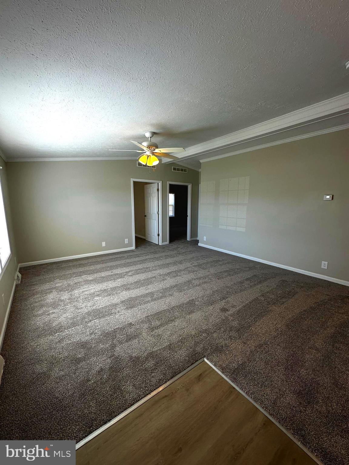 11433 Trussum Pond Road Laurel, DE 19956 - Photo 11 of 27 an empty room with a empty space and windows