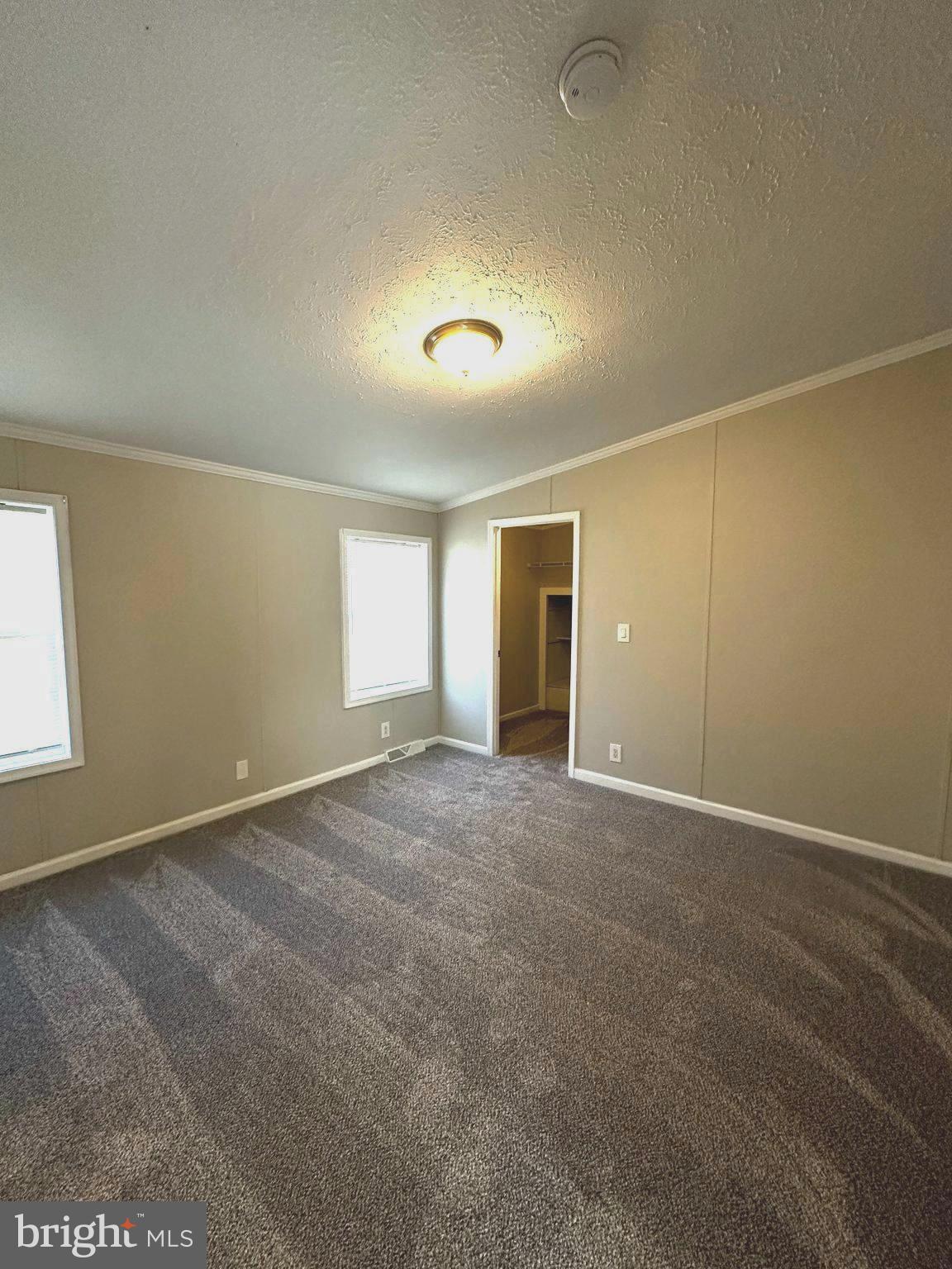 11433 Trussum Pond Road Laurel, DE 19956 - Photo 17 of 27 a view of an empty room with a window
