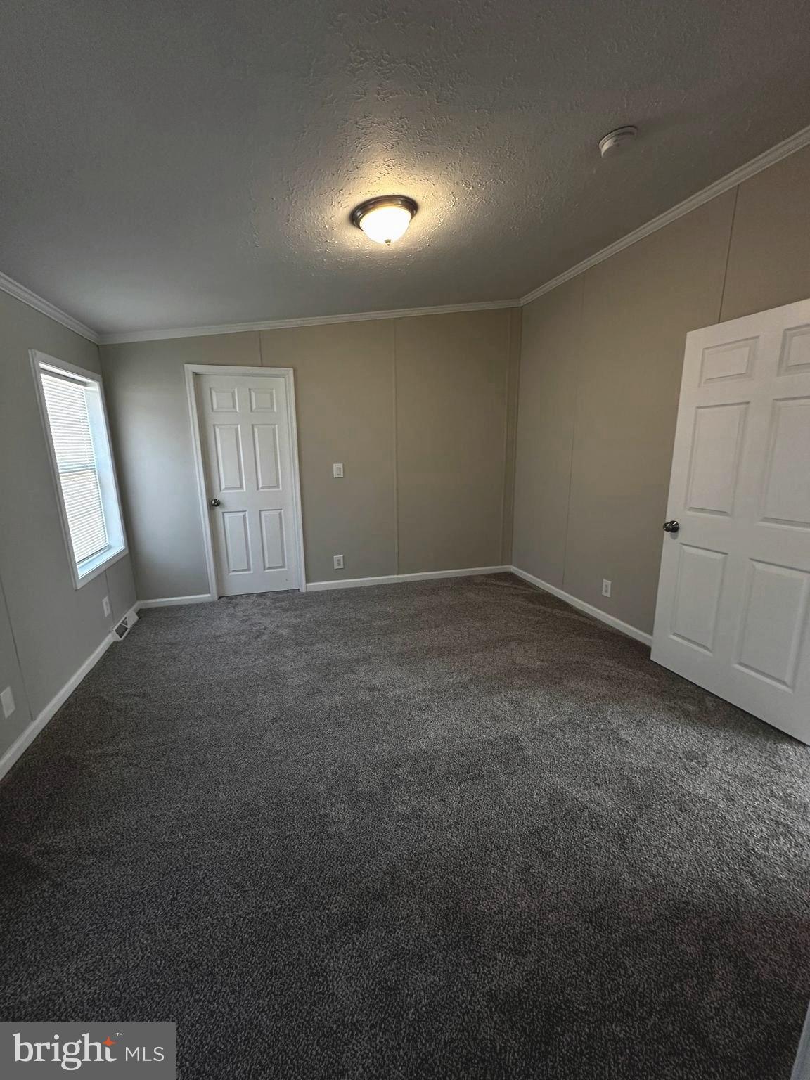 11433 Trussum Pond Road Laurel, DE 19956 - Photo 18 of 27 an empty room with windows
