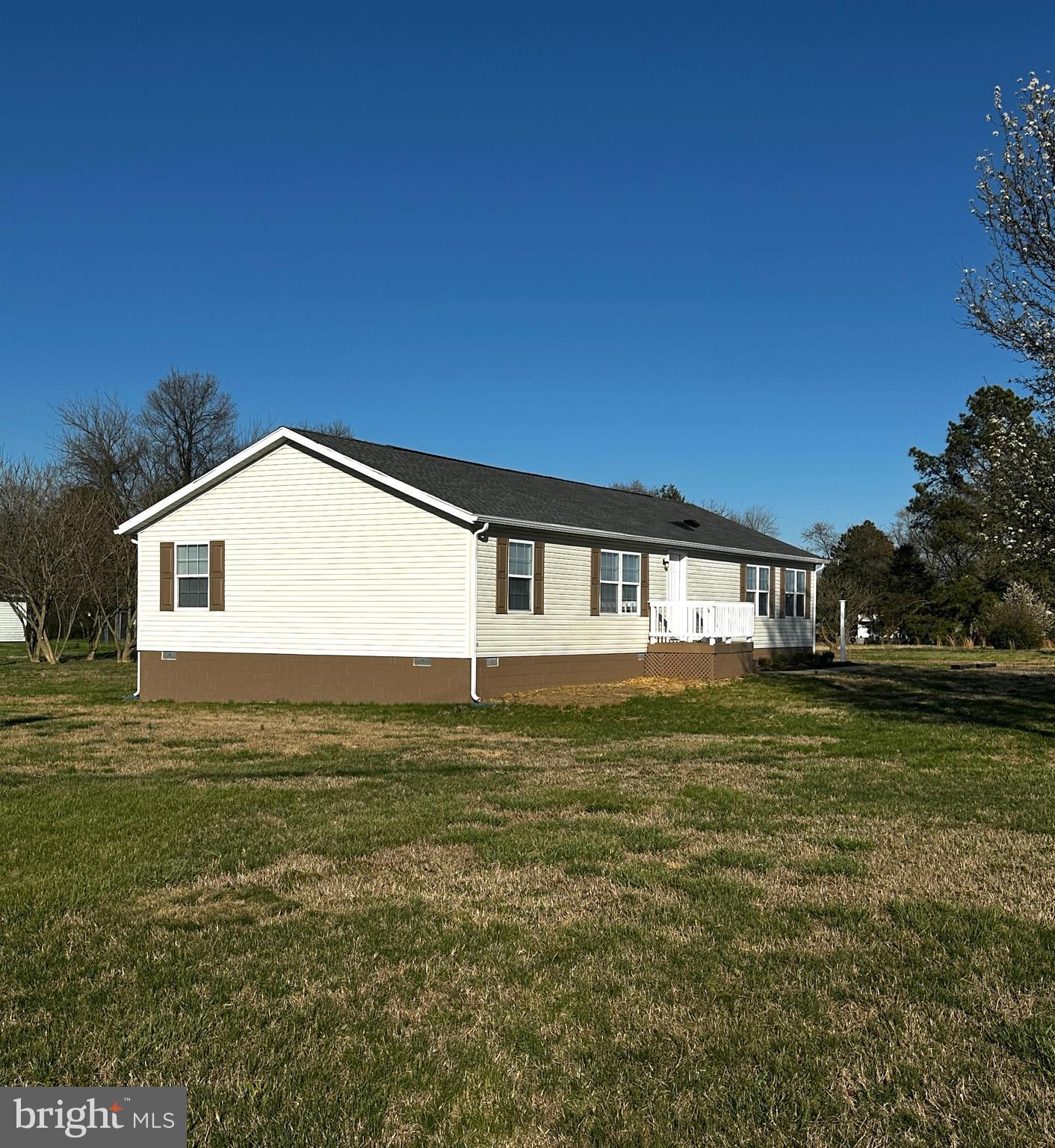 11433 Trussum Pond Road Laurel, DE 19956 - Photo 2 of 27 a front view of a house with a garden