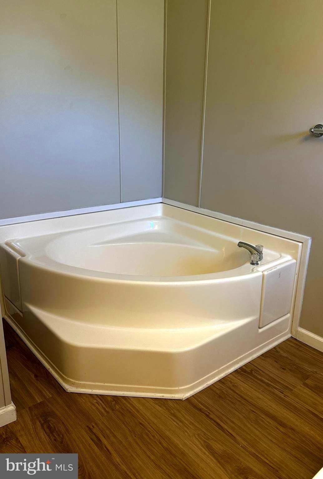 11433 Trussum Pond Road Laurel, DE 19956 - Photo 21 of 27 a bathroom with a bathtub