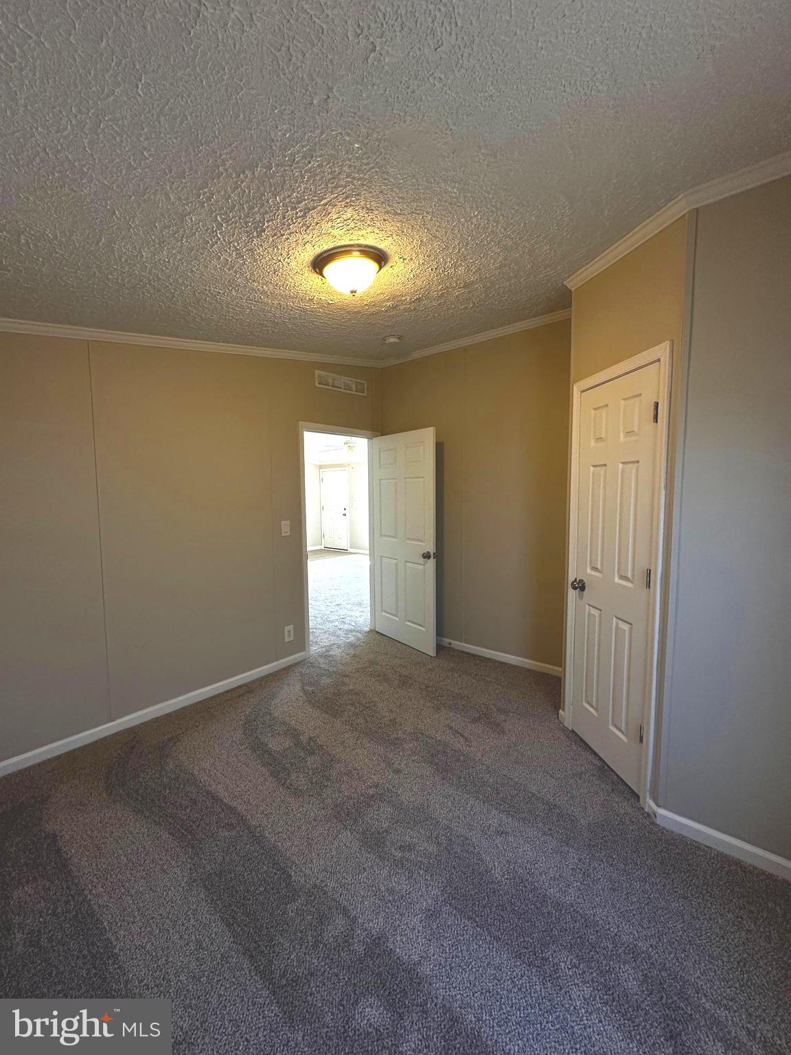 11433 Trussum Pond Road Laurel, DE 19956 - Photo 25 of 27 an empty room with windows