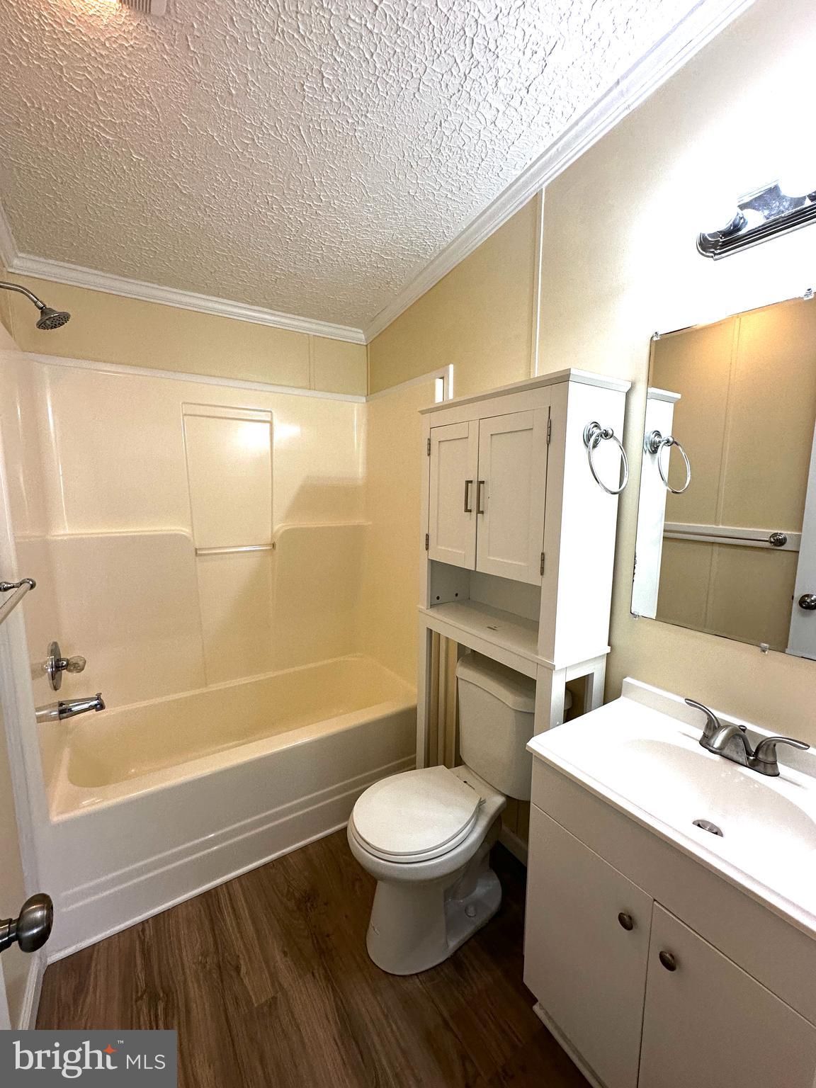 11433 Trussum Pond Road Laurel, DE 19956 - Photo 26 of 27 a bathroom with a sink a toilet and shower
