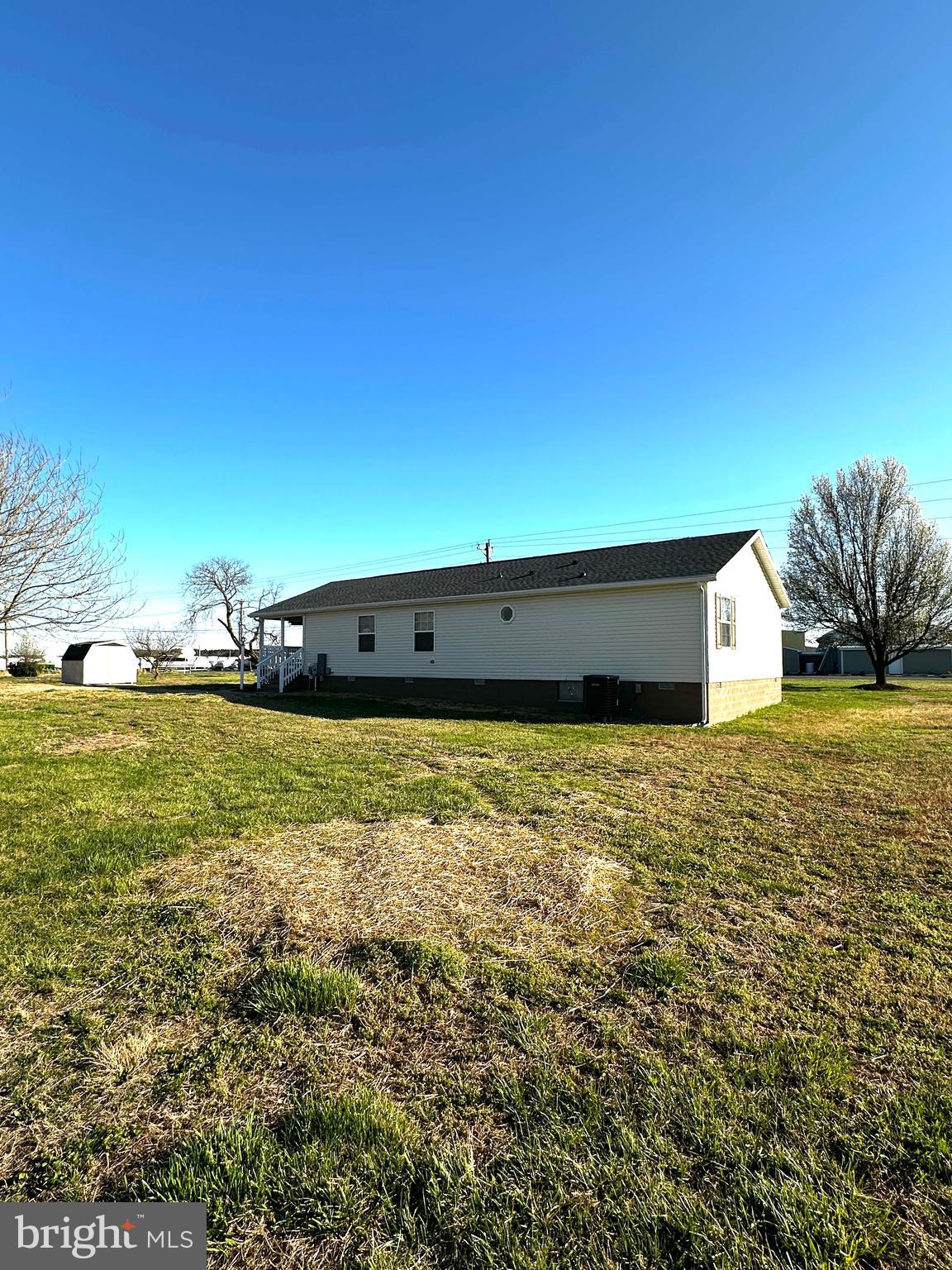 11433 Trussum Pond Road Laurel, DE 19956 - Photo 4 of 27 a view of an ocean and a yard