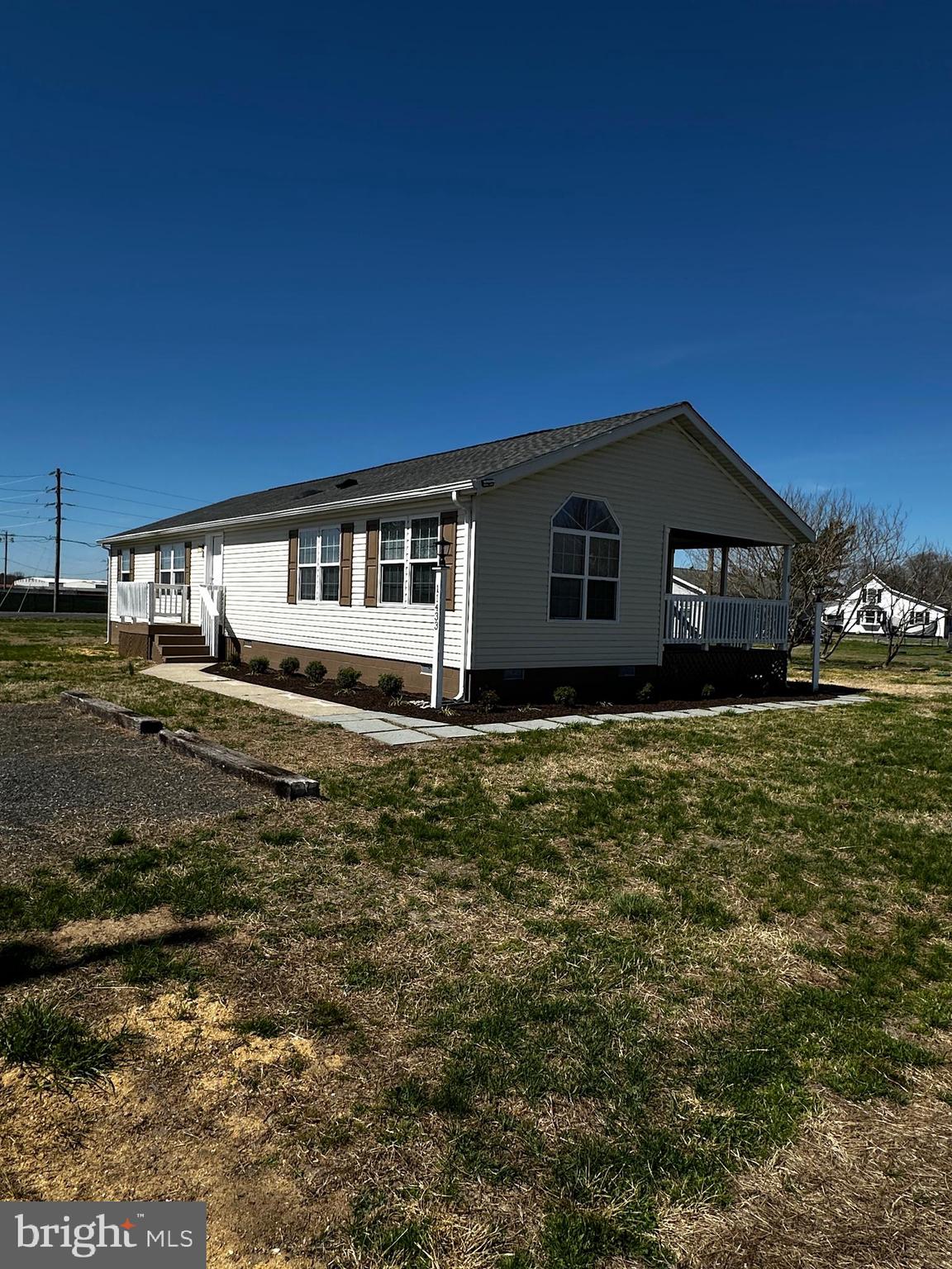 11433 Trussum Pond Road Laurel, DE 19956 - Photo 7 of 27 a front view of a house with a garden