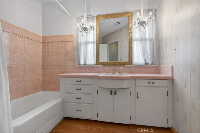 a kitchen with cabinets appliances and a window