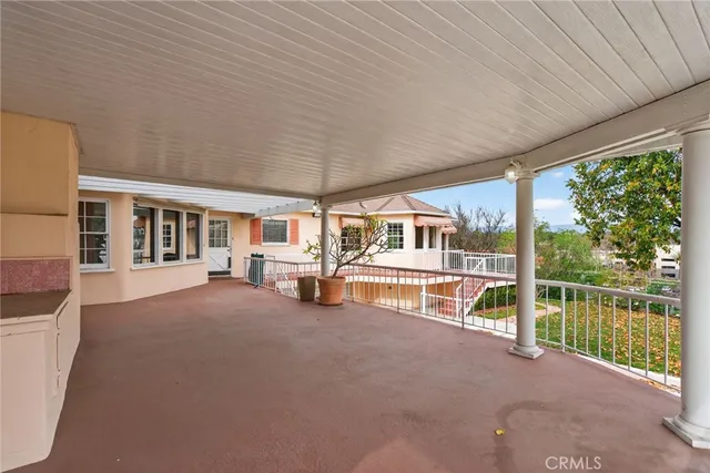a view of balcony with furniture