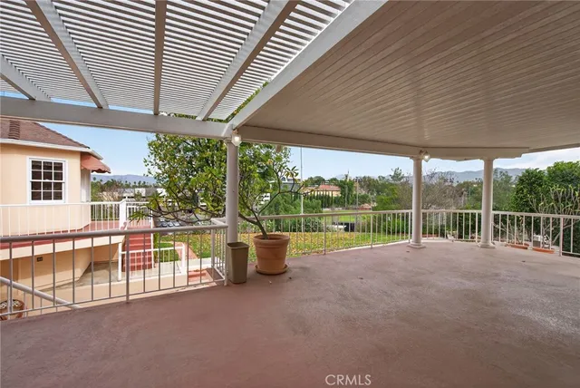 a view of house with backyard