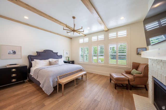 630 East Center Street Alpine, UT 84004 - Photo 41 of 115 Spacious room featuring wood-finish flooring, exposed ceiling beams, recessed lighting, and a linear chandelier
