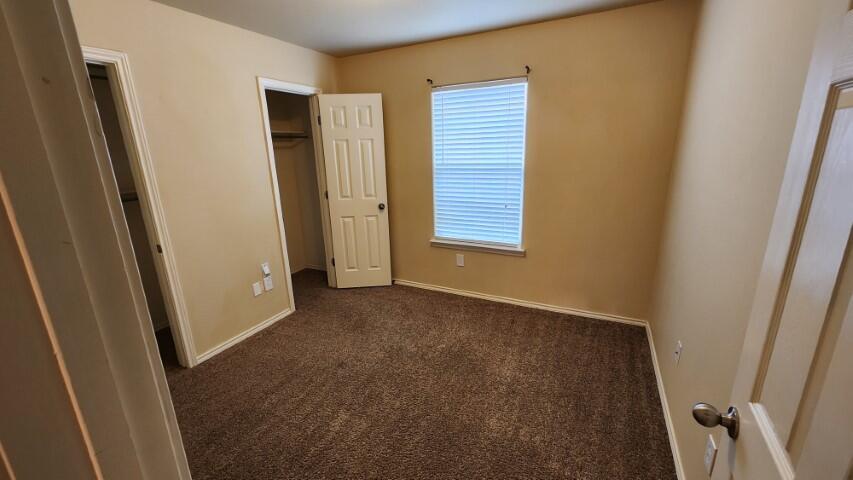 6535 93rd Street Lubbock, TX 79424 - Photo 9 of 13 a view of an empty room with a window