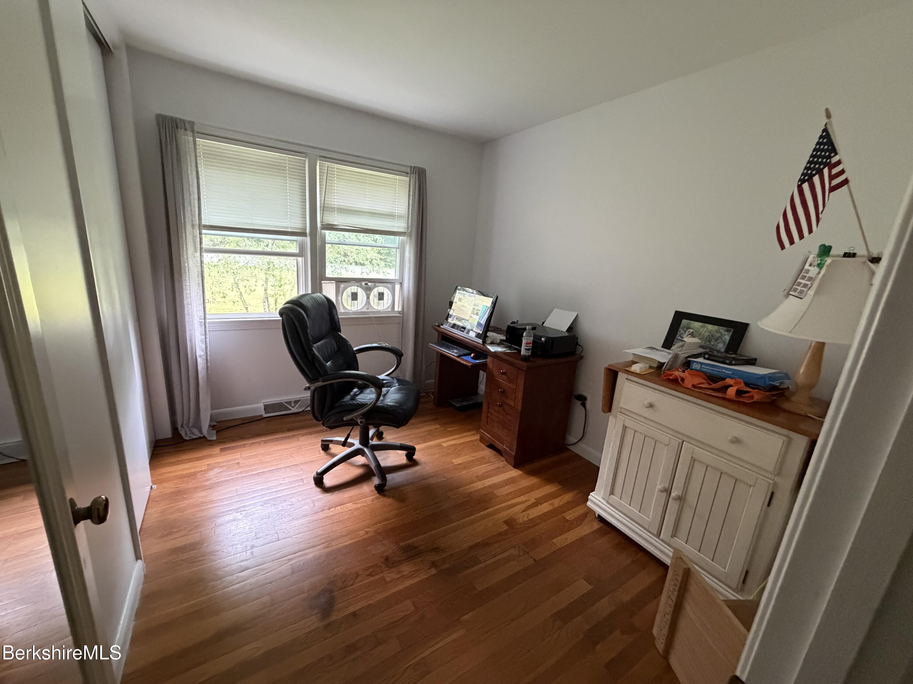20 Sullivan Lane Lenox, MA 01240 - Photo 9 of 23 a view of a workspace with furniture and a window