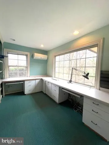 a kitchen with a sink and a large window