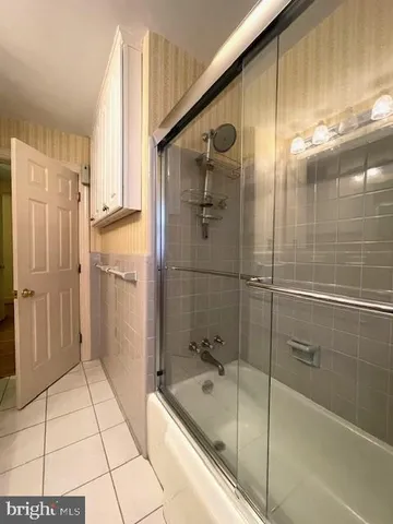 a kitchen with a sink a counter and a cabinets