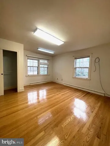 a view of room with walk in closet and empty room