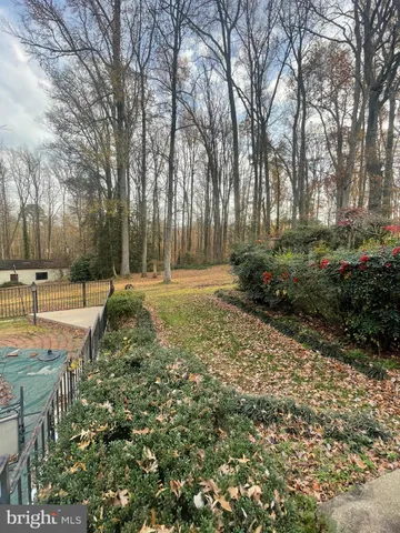 a view of a backyard with sitting area