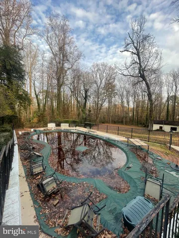a view of backyard with large trees
