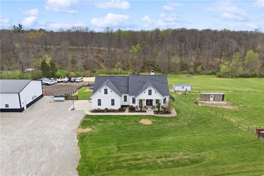 1158 Pyle Road Clarksville, OH 45113 - Photo 9 of 76 This charming modern farmhouse features a picturesque setting with vast green acreage and mature trees.