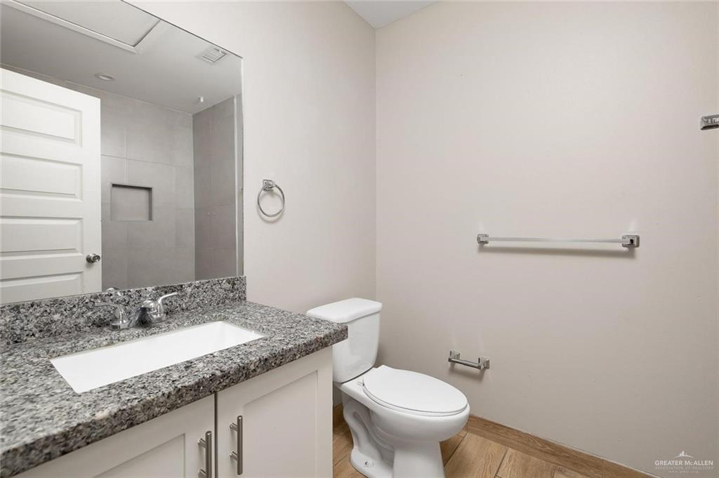 826 South Missouri Street, Unit D Alton, TX 78573 - Photo 7 of 8 Bathroom with vanity and light wood finished floors