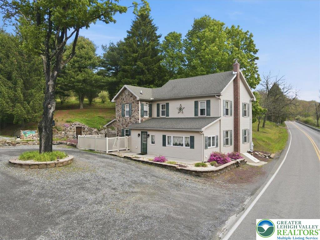 4880 Little Gap Road Kunkletown, PA 18058 - Photo 3 of 100 This charming home features a timeless stone and siding facade, offering both character and durability.