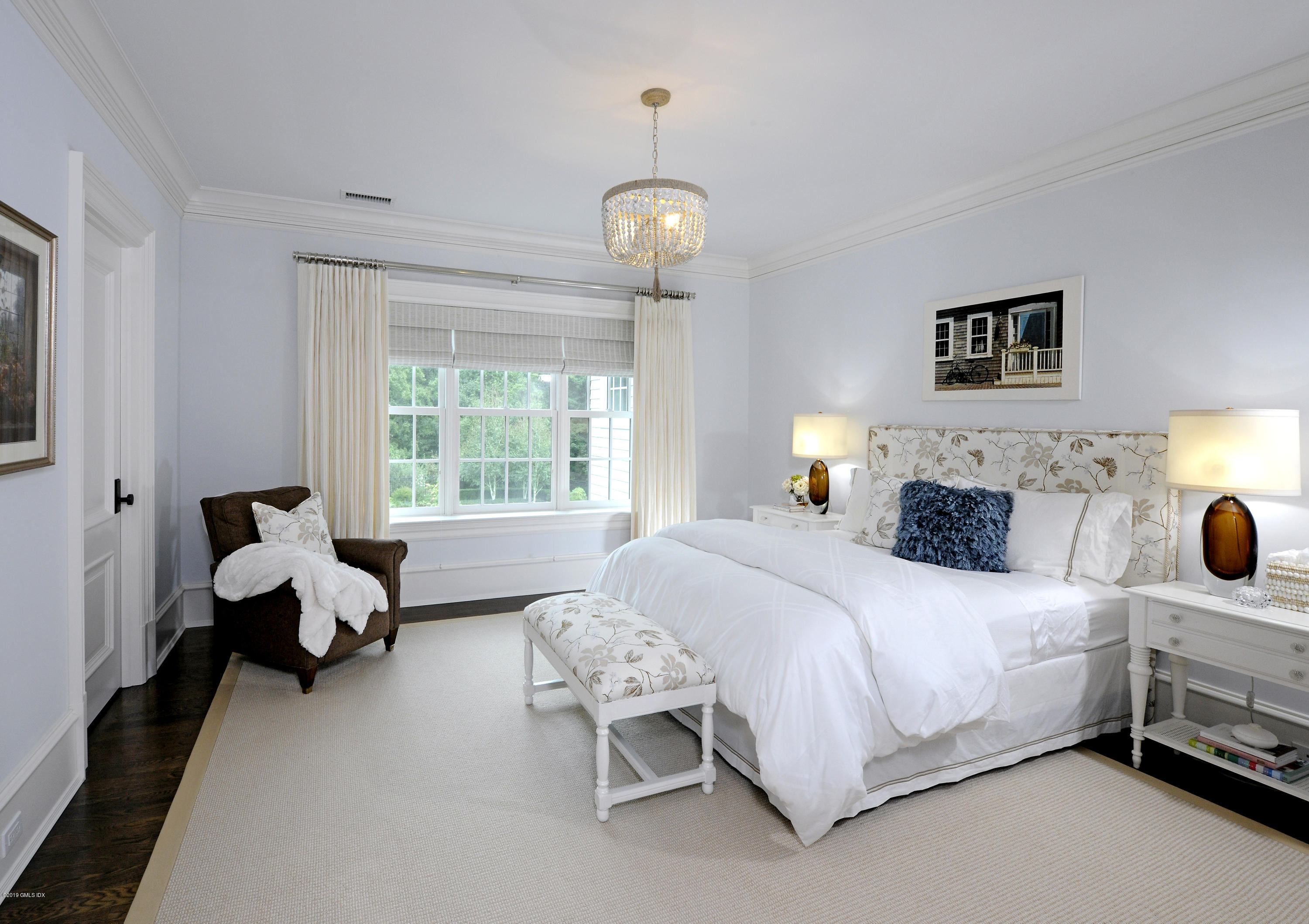 22 Cornelia Drive Greenwich, CT 06830 - Photo 15 of 34 a bedroom with a bed and wooden floor