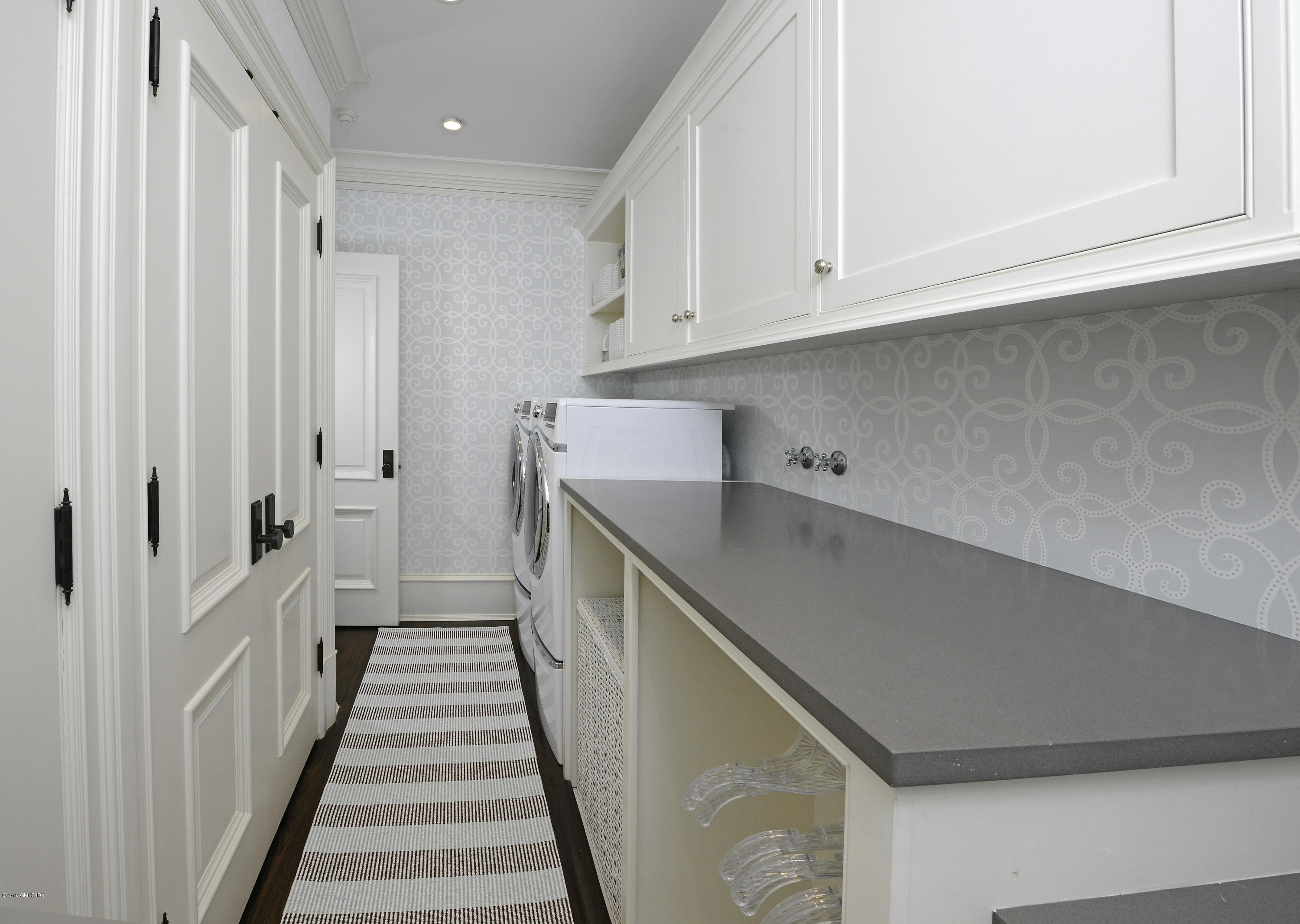 22 Cornelia Drive Greenwich, CT 06830 - Photo 18 of 34 a view of a kitchen with cabinets and stairs