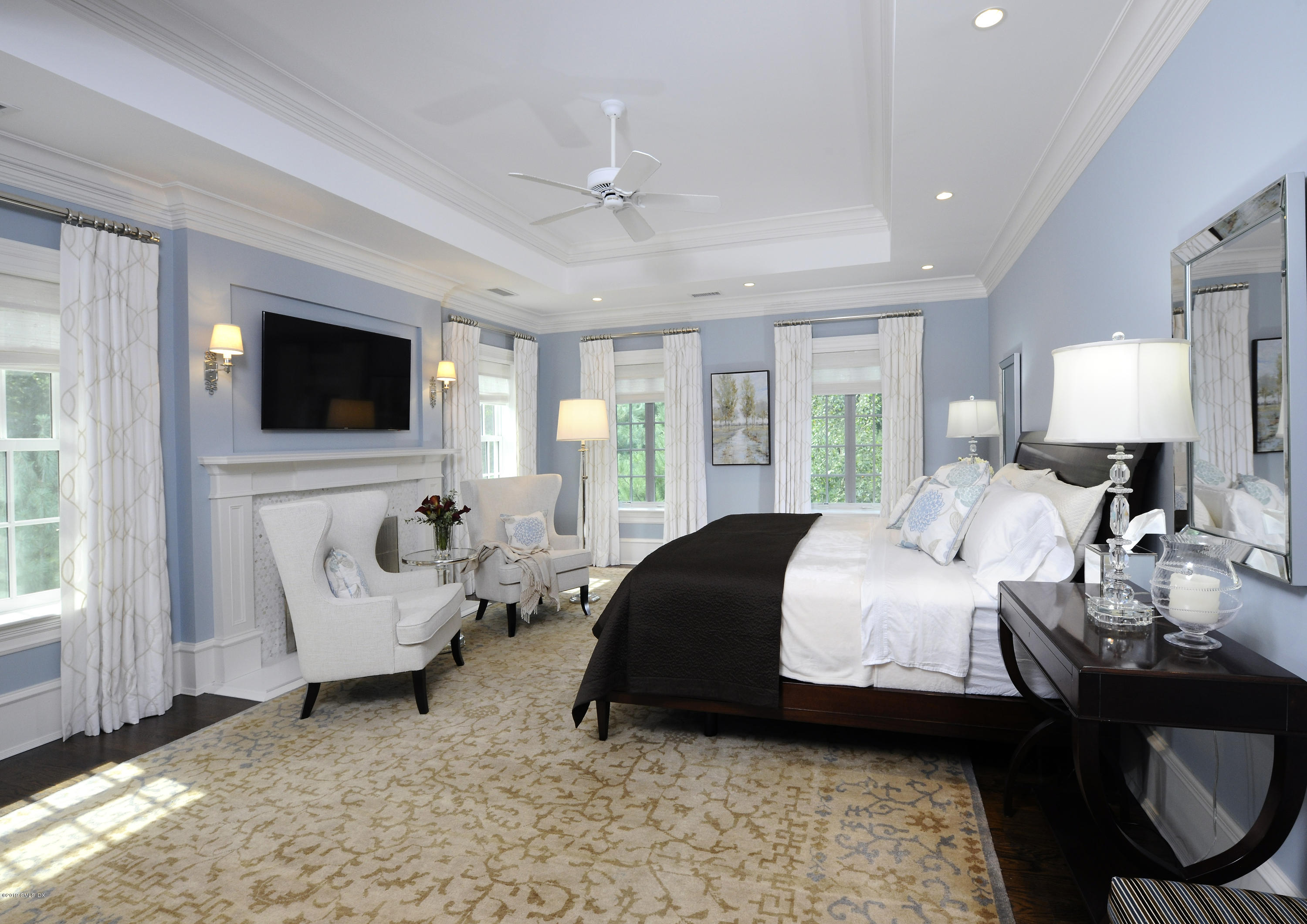 22 Cornelia Drive Greenwich, CT 06830 - Photo 20 of 34 a bedroom with furniture and a flat screen tv