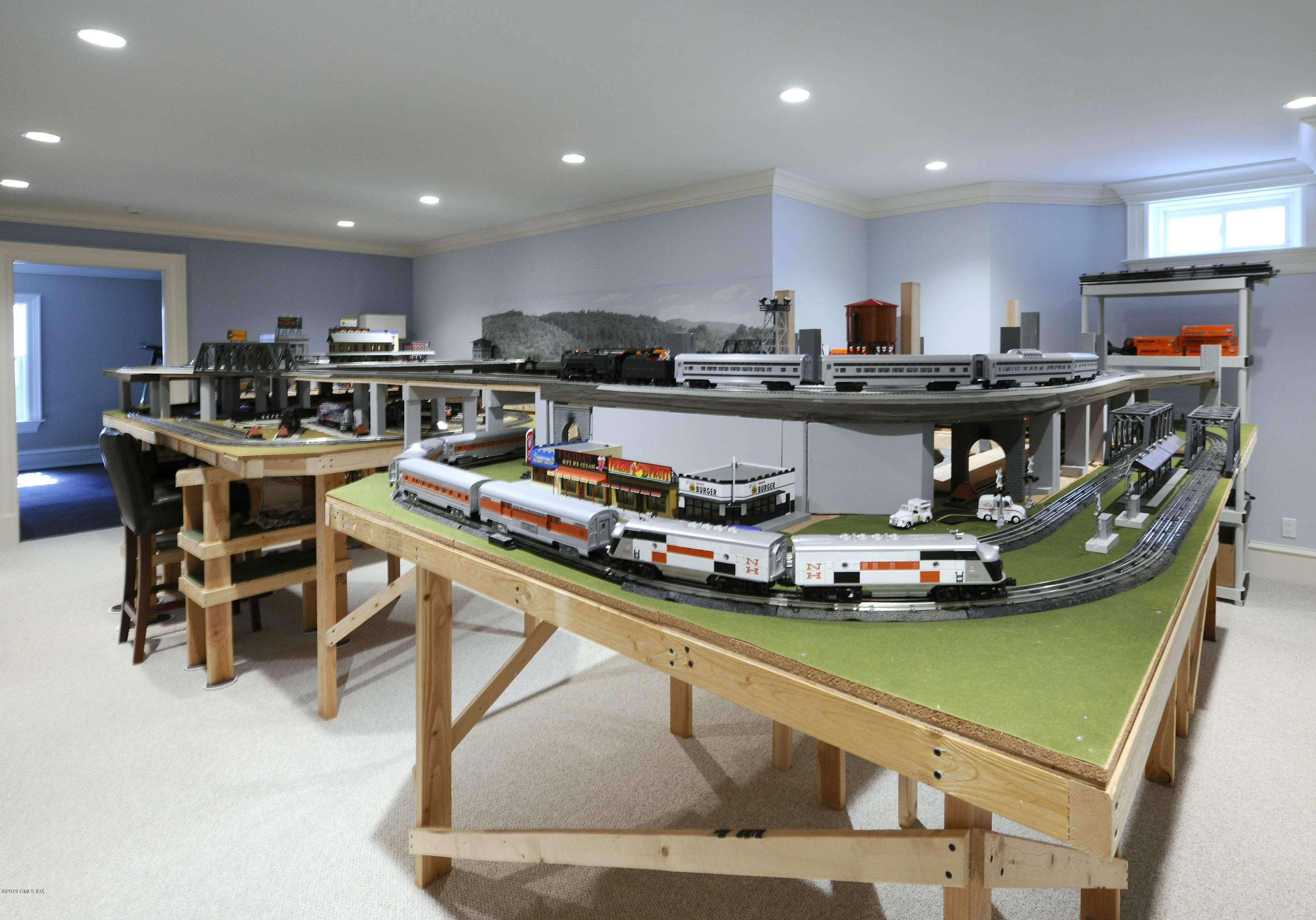 22 Cornelia Drive Greenwich, CT 06830 - Photo 26 of 34 a kitchen with stainless steel appliances lots of white furniture a refrigerator and a stove