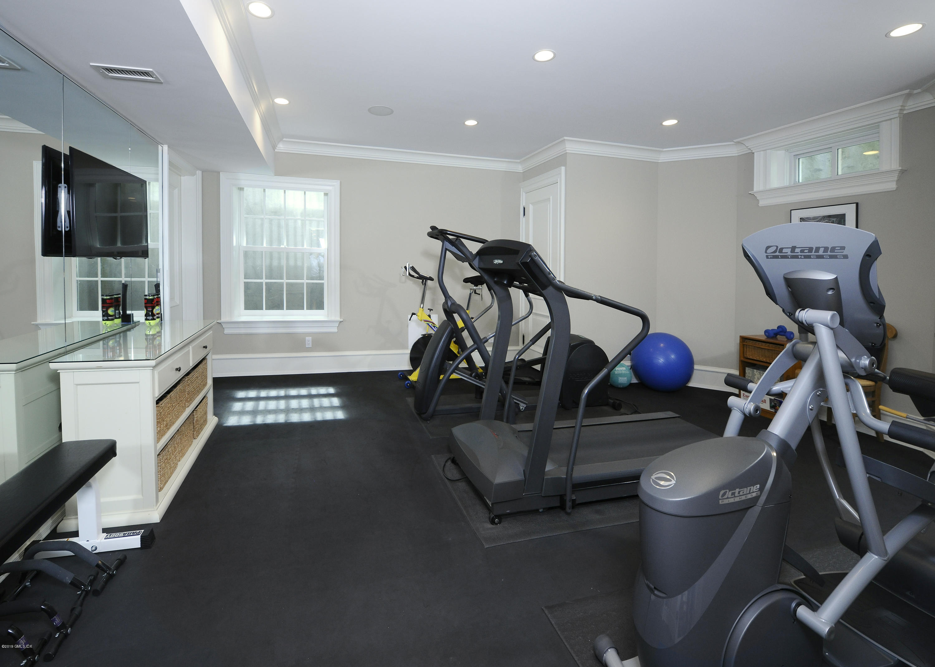 22 Cornelia Drive Greenwich, CT 06830 - Photo 27 of 34 a room with furniture and a flat screen tv