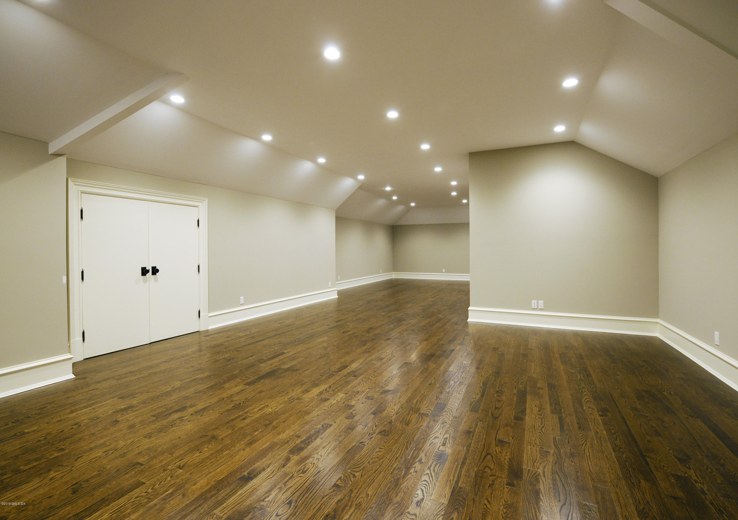 22 Cornelia Drive Greenwich, CT 06830 - Photo 30 of 34 a view of empty room with wooden floor