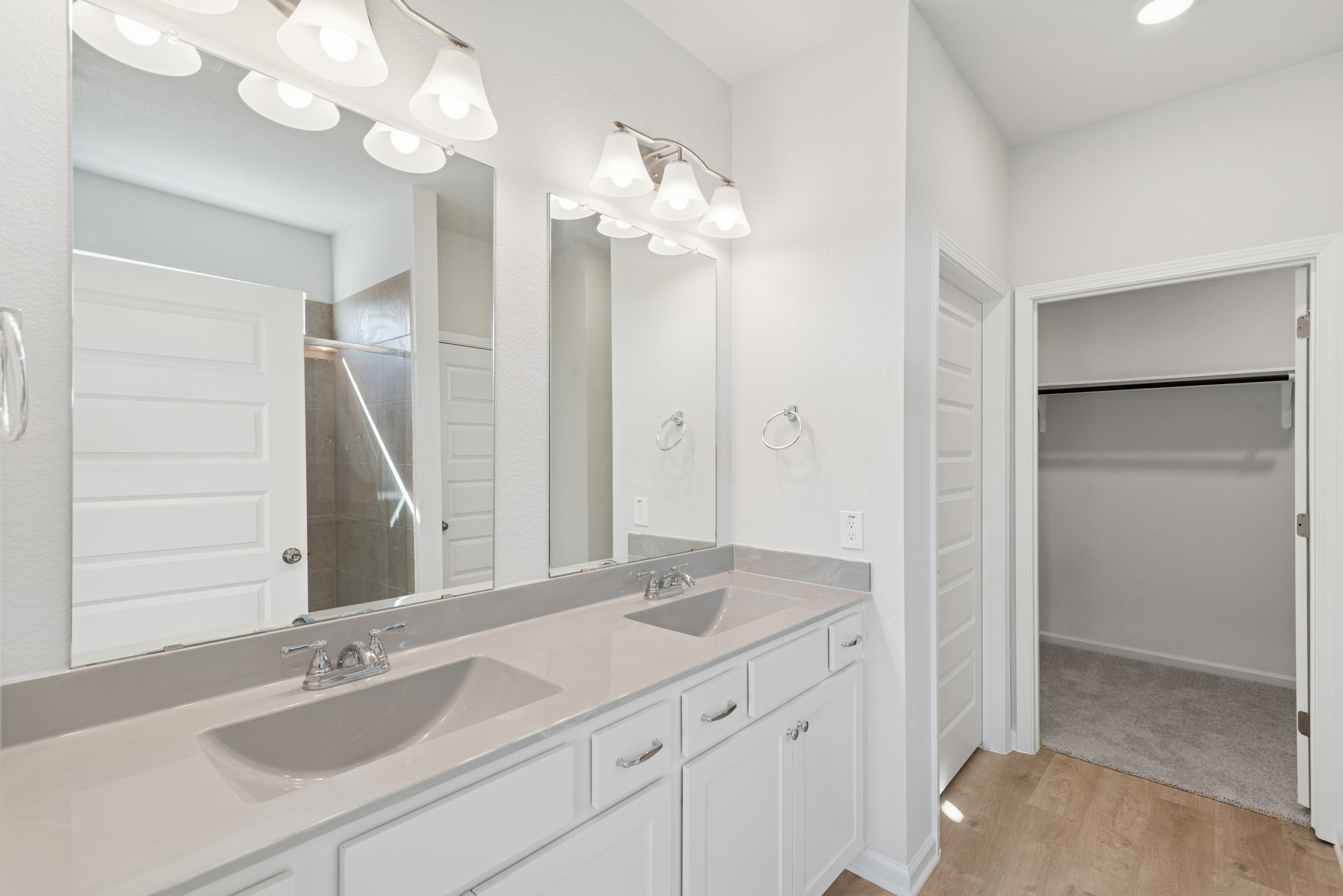 9761 Enclave Ridge Road Willis, TX 77318 - Photo 13 of 28 a bathroom with a sink vanity granite and a mirror