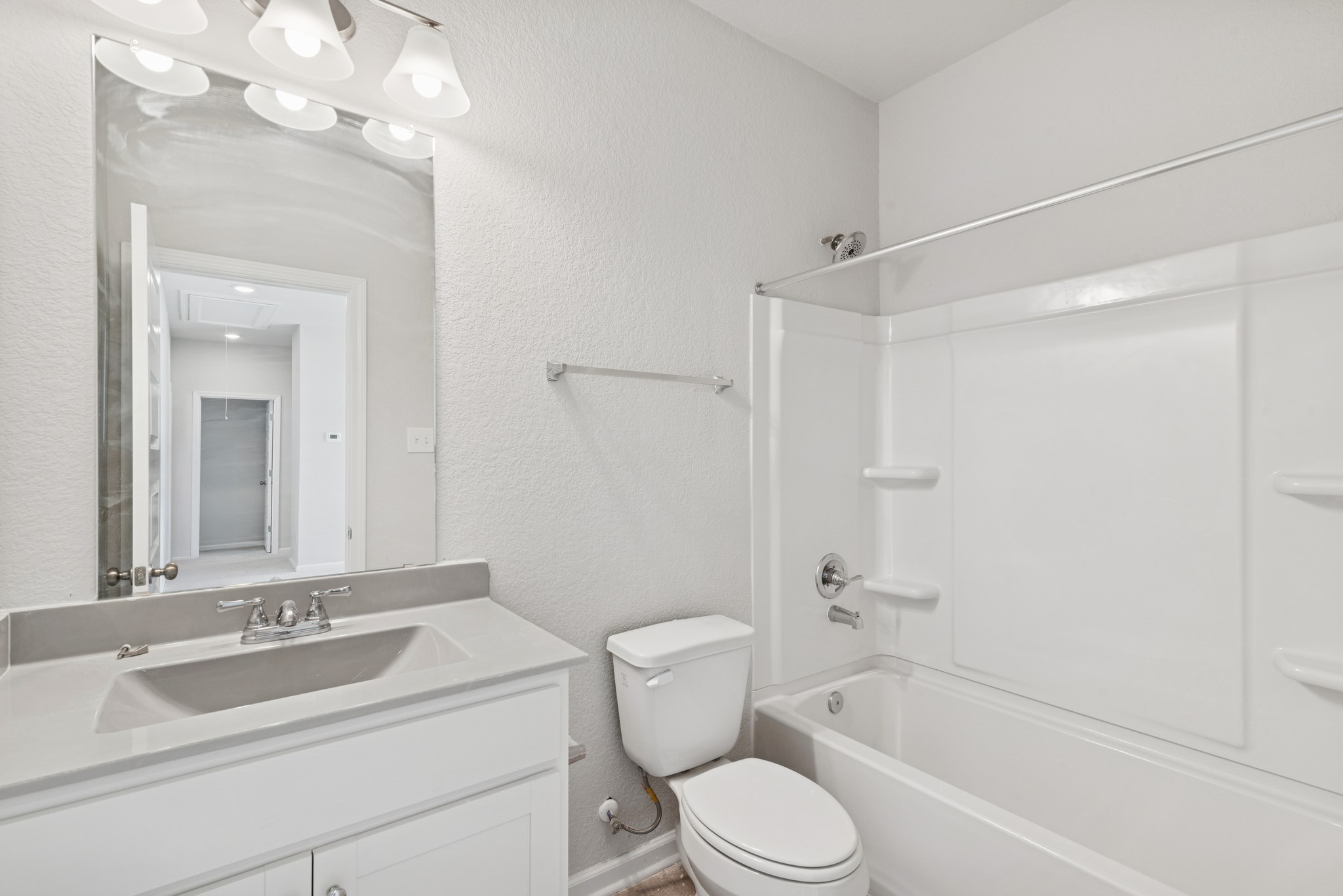 9761 Enclave Ridge Road Willis, TX 77318 - Photo 19 of 28 a bathroom with a sink a toilet and shower