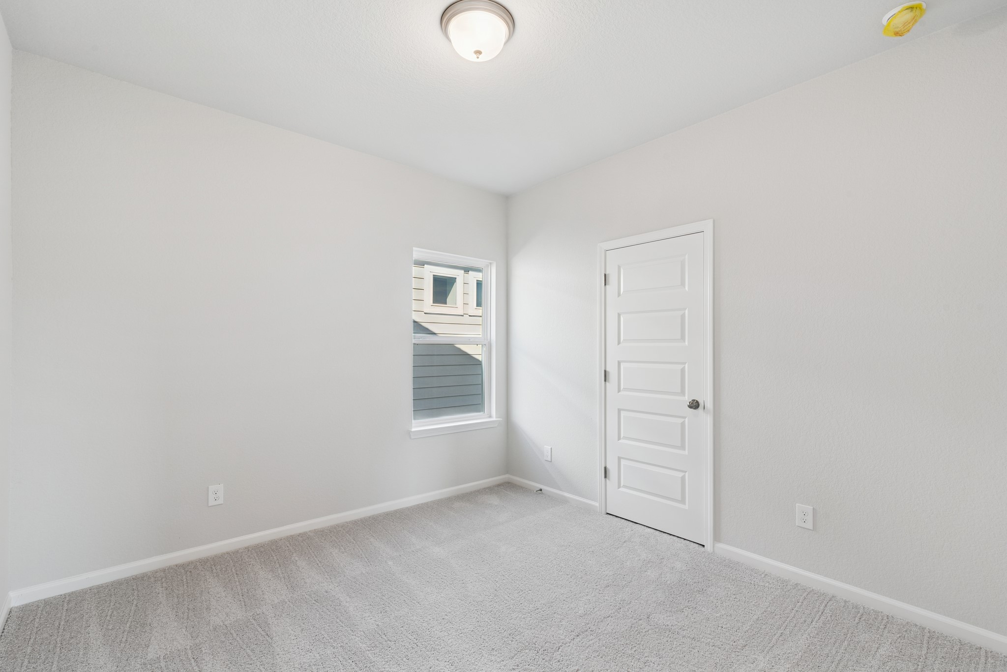 9761 Enclave Ridge Road Willis, TX 77318 - Photo 20 of 28 an empty room with windows
